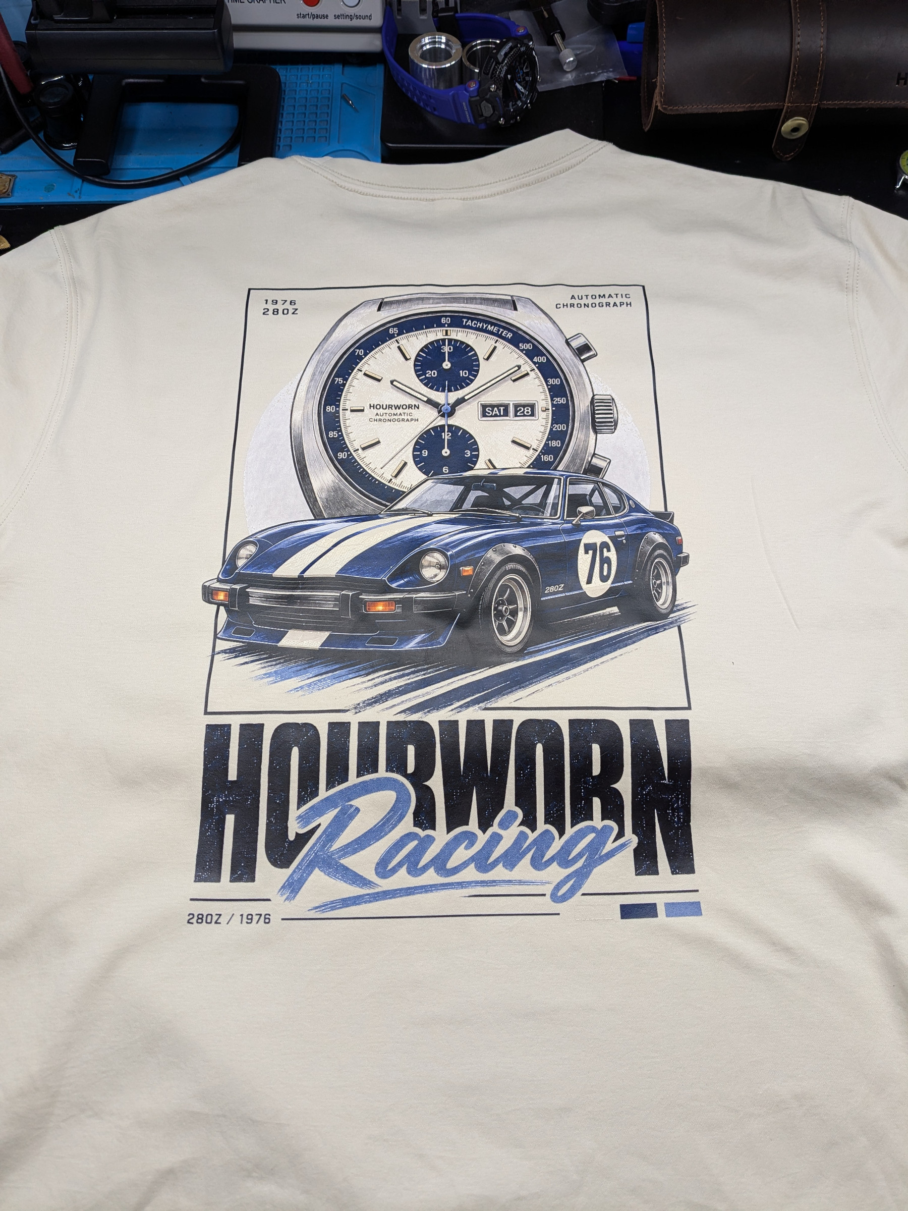 Hourworn Racing test print with a blue 280Z and chronograph on a light T-shirt