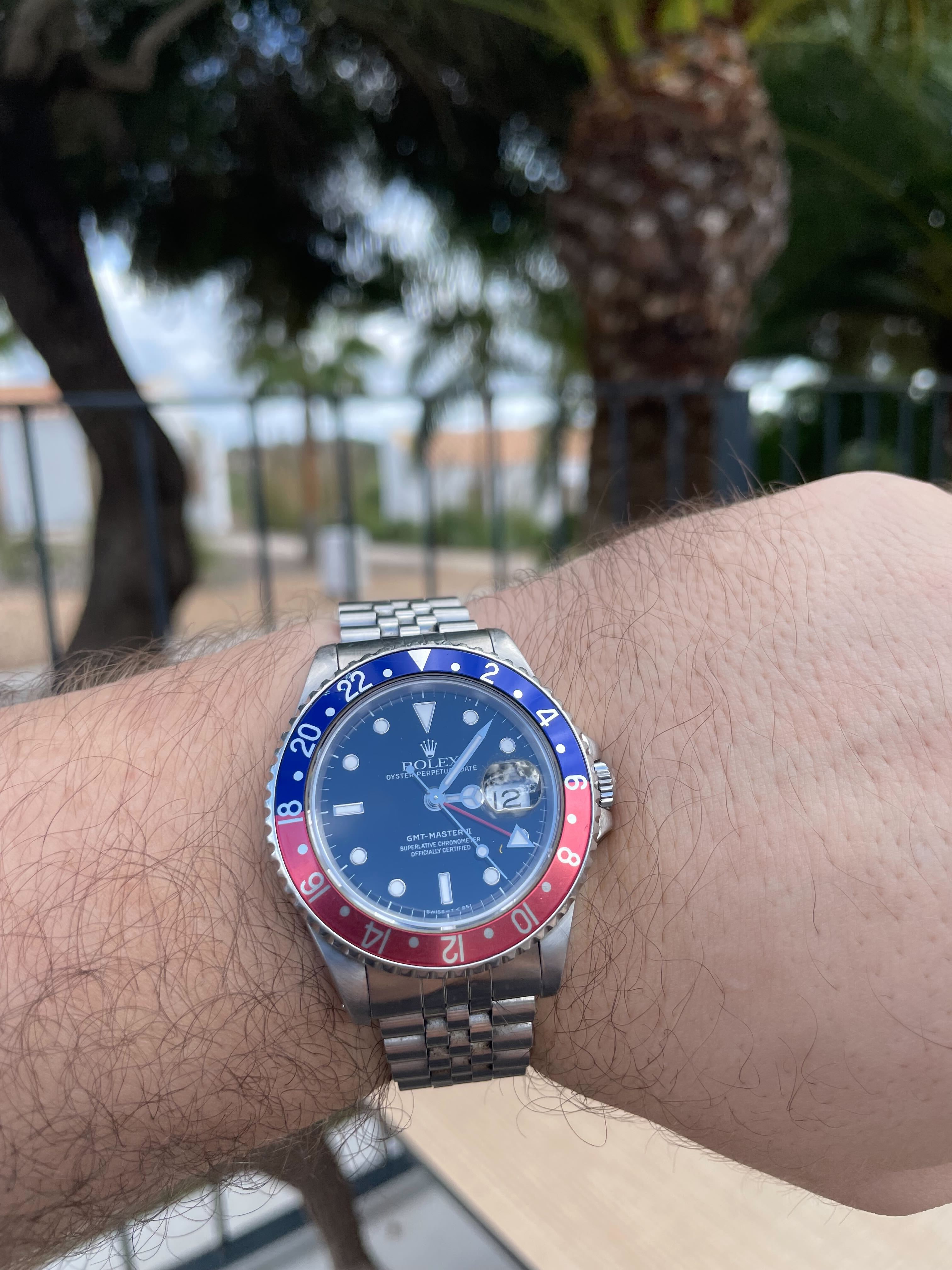 Later reference: Rolex GMT-Master II 16710, described by the photographer as a 1989 example. Photograph taken in 2022. Shown for its red-and-blue bezel; not a 1955 archival photograph.